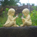 Creatieve hars tuinbeeld-Jongen en meisje standbeeld-decoratief tuinfiguur met glow in the dark poeder